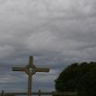 Cross under stormy skies